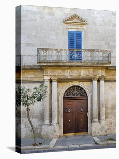 Italy, Puglia, Brindisi, Itria Valley, Ostuni. Wooden door with balcony above and blue shutters.-Julie Eggers-Premier Image Canvas