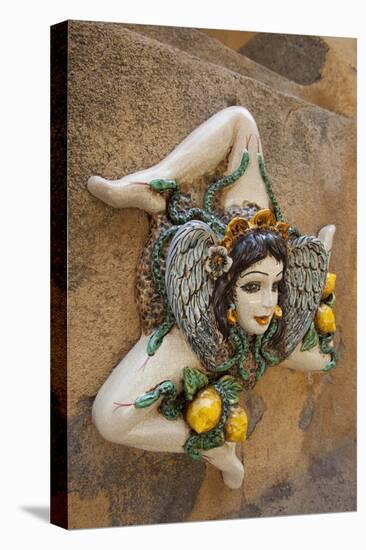 Italy, Sicily, Taormina, ceramic woman with lemons on wall.-Merrill Images-Premier Image Canvas