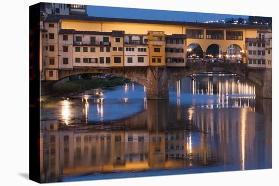 Italy, Tuscany, Florence, Ponte Vecchio reflected in Arno River at dusk.-Merrill Images-Premier Image Canvas