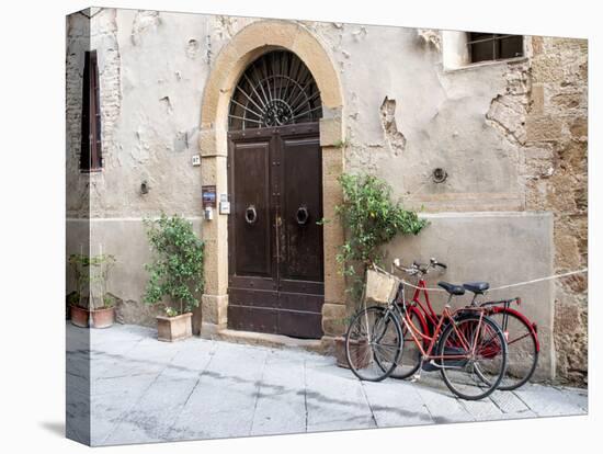 Italy, Tuscany, Pienza. Bicycles Parked Along the Streets of Pienza-Julie Eggers-Premier Image Canvas