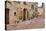 Italy, Tuscany, Pienza. Flower pots and potted plants decorate a narrow street in a Tuscany-Julie Eggers-Premier Image Canvas