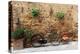 Italy, Tuscany, province of Siena, Chiusure. Hill town. Bicycle leans against stone wall.-Emily Wilson-Premier Image Canvas