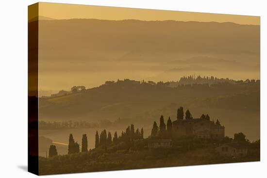 Italy, Tuscany, San Gimignano, farmhouses on ridges with fog at dawn.-Merrill Images-Premier Image Canvas