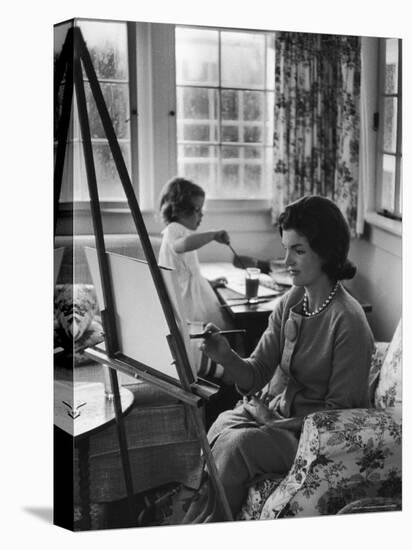 Jackie Kennedy, Wife of Sen, Painting on an easel as Daughter Caroline Paints on Table at Home-Alfred Eisenstaedt-Premier Image Canvas