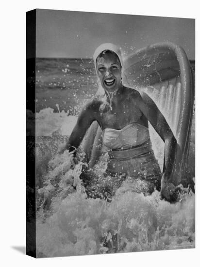 Janet Sims Playing in the Water on a Plastic Boat-George Silk-Premier Image Canvas