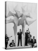 Jazz Drummer Chico Hamilton Playing with Band Behind Sculpture Called "Counterpoints"-Gordon Parks-Premier Image Canvas