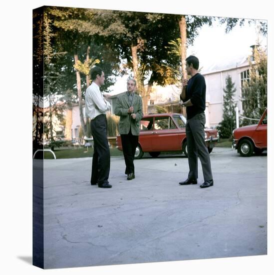 Jean-Paul Belmondo, Rene Clement and Alain Delon on set of film 'Is Paris burning?', 1966 (photo)-null-Stretched Canvas