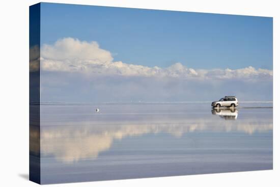 Jeep driving on the reflected surface of the salt flat, Salar de Uyuni, Potosi Department, Bolivia.-Keren Su-Premier Image Canvas