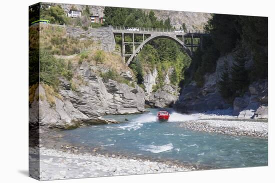 Jet boat on the Shotover River below the Edith Cavell Bridge, Queenstown, Queenstown-Lakes district-Ruth Tomlinson-Premier Image Canvas