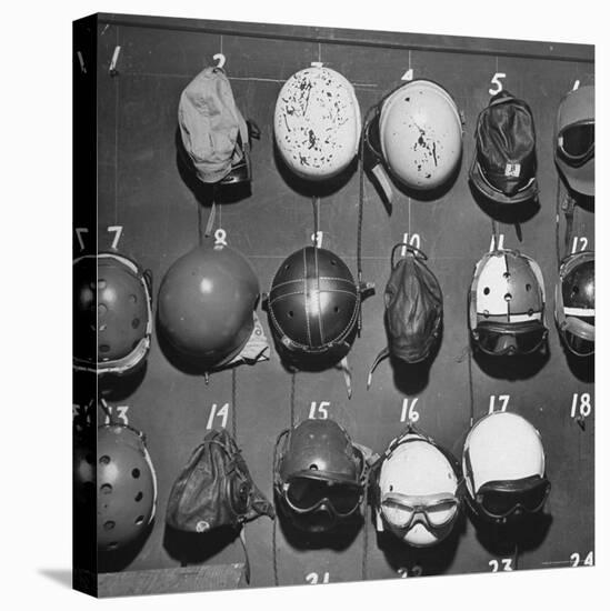 Jet Pilot Helmets and Goggles Hanging on Hooks-Charles E^ Steinheimer-Premier Image Canvas