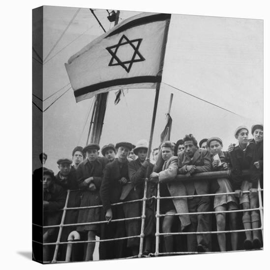 Jewish Immigrants, Arriving in Haifa Aboard Refugee Ship, Waving Future Flag of the State of Israel-Dmitri Kessel-Premier Image Canvas