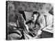 Jimmy Stewart, Dressed in Silk Pajamas Reading Magazine in Bed in Family Home-Peter Stackpole-Premier Image Canvas