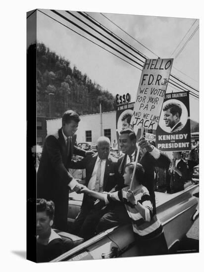 John F. Kennedy and Franklin D. Roosevelt Jr. Shaking Hands with Boy During Parade-Hank Walker-Premier Image Canvas