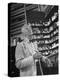 John Rogers in the Prescription Room of His Old-Fashioned Pharmacy-null-Premier Image Canvas