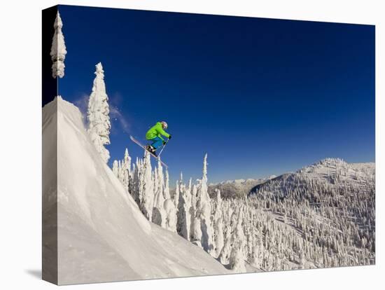 Jumping from Cliff on a Sunny Day at Whitefish Mountain Resort, Montana, Usa-Chuck Haney-Premier Image Canvas