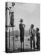 Kenneth Merriman on higher stilts than his brothers and friend-Robert W^ Kelley-Premier Image Canvas