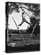 Kenneth Merriman Swinging on Tree Limb After Kicking Away Stilts-Robert W^ Kelley-Premier Image Canvas