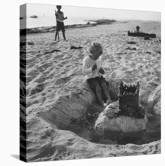 Kid Playing in Sand-Martha Holmes-Premier Image Canvas