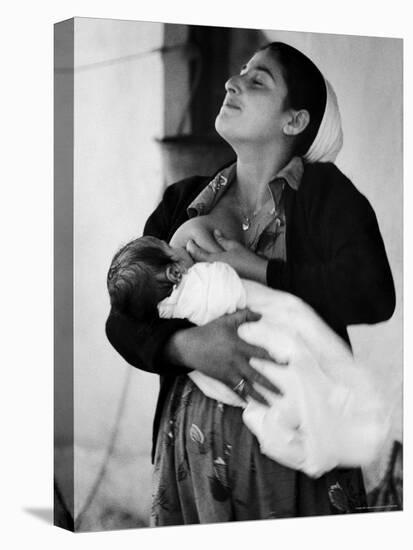 Kurdi Mother, One of the Most Primitive Tribes of Israel, Nursing Child in Mountain Colony-Paul Schutzer-Premier Image Canvas