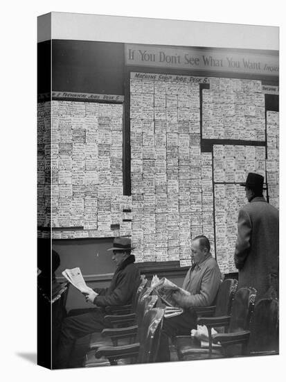 Large Board Containing Small Hand Written Pieces of Paper Announcing Various Jobs and the Salaries-Al Fenn-Premier Image Canvas