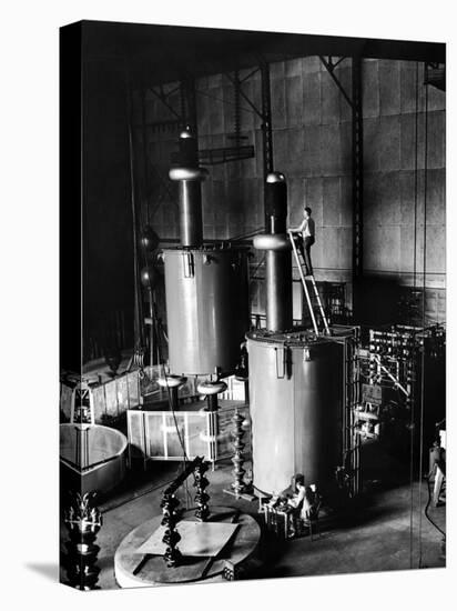 Large Cylinders, One W Man on Top Climbing Ladder at Westinghouse Plant-Alfred Eisenstaedt-Premier Image Canvas