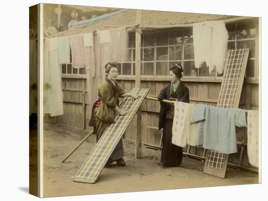 Laundry Day in Japan: Two Women Hang Up Clothes and Fabric to Dry Outdoors-null-Premier Image Canvas