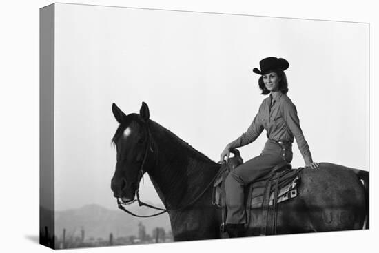 Lee Archer, 24, Riding a Horse at O.B. Llyod Stables in Scottsdale, Arizona, October 1960-Allan Grant-Premier Image Canvas