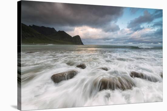 Lights of midnight sun lights up the waves of the blue sea, Unstad, Vestvagoy, Lofoten Islands, Nor-Roberto Moiola-Premier Image Canvas