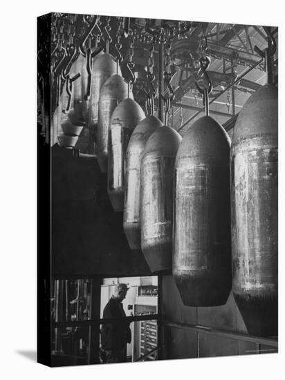 Line of 500 lbs Bombs Jiggling Along on Overhead Conveyor Hooks Abover Worker-Andreas Feininger-Premier Image Canvas