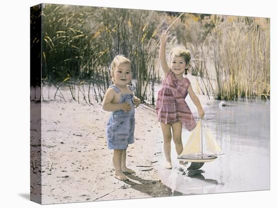 Little Boy and Girl Playing with Toy Sail Boat-Nora Hernandez-Premier Image Canvas