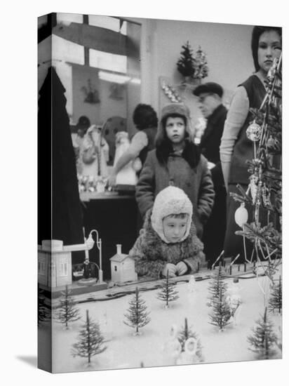 Little Boy Looking at Train Set in Moscow Department Store-James Whitmore-Premier Image Canvas