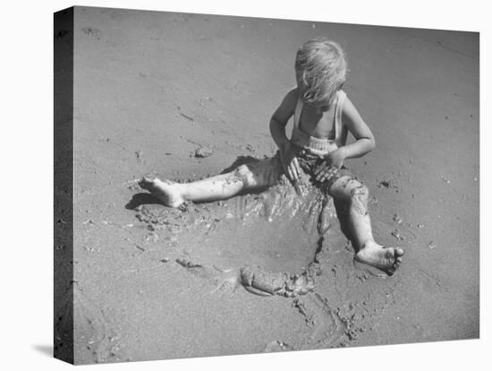 Little Boy Playing on the Beach at Ebb Tide-Bernard Hoffman-Premier Image Canvas