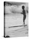 Little Boy Standing on a Surf Board Staring at the Water-Allan Grant-Premier Image Canvas
