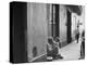 Little Girl Cleaning Face of a Street Beggar-null-Premier Image Canvas