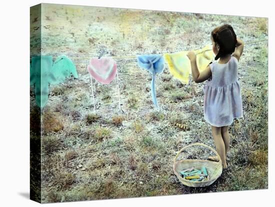 Little Girl Hanging Laundry-Nora Hernandez-Premier Image Canvas