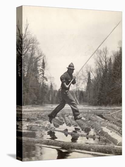 Log Driver Leaping Across Floating Logs to Keep Them Moving by Breaking Loose Any That Get Jammed-Margaret Bourke-White-Premier Image Canvas