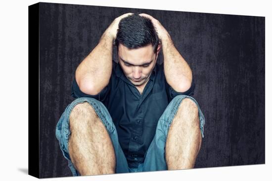 Lonely and Sad Young Man Sitting on the Floor with His Head between His Hands-Kamira-Premier Image Canvas