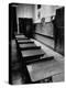 Looking Down Row of Empty Scarred Old Fashioned Desks in Schoolroom-Walter Sanders-Premier Image Canvas