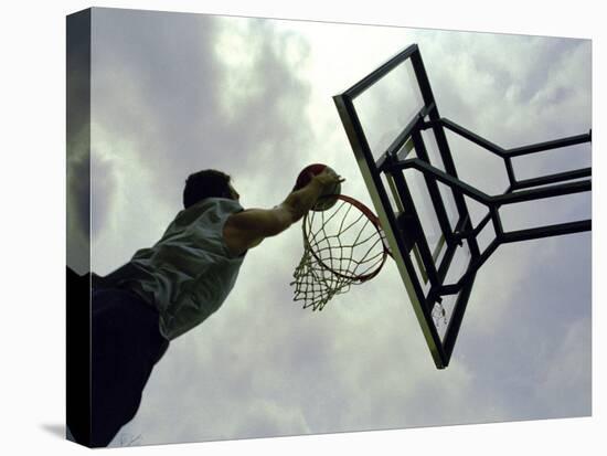 Low Angle View of a Man Shooting a Basket-null-Premier Image Canvas