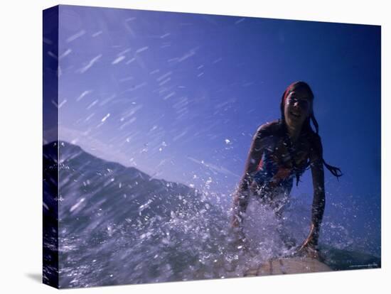 Low Angle View of a Teenage Girl Riding a Surfboard-George Silk-Premier Image Canvas