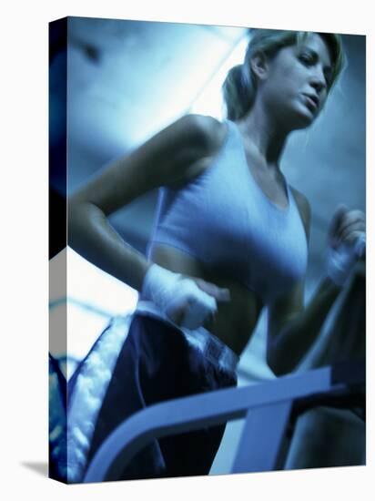 Low Angle View of a Young Woman Running on a Treadmill-null-Premier Image Canvas