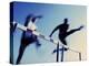 Low Angle View of Athletes Jumping over Hurdles-null-Premier Image Canvas