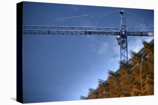 Low Angle View of Crane on Construction Site-David Barbour-Stretched Canvas