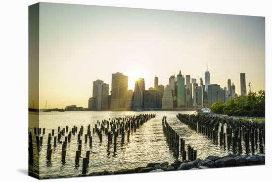 Lower Manhattan skyline across the East River at sunset, New York City, New York, United States of -Fraser Hall-Premier Image Canvas