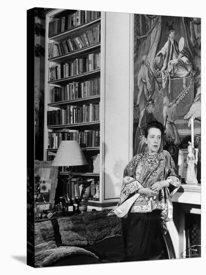 Madam Elsa Schiaparelli Enjoying Her Study Which is Filled with Treasures, Paintings, and Books-Hans Wild-Premier Image Canvas