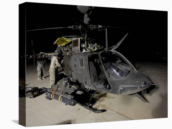 Maintenance Crew Works on Servicing the OH-58 Kiowa before its Next Mission-Stocktrek Images-Premier Image Canvas