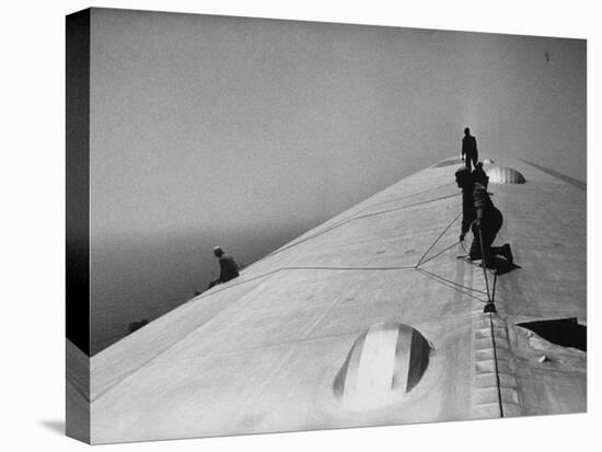 Maintenance Crewmen on Top of Graf Zeppelin repair damage caused Atlantic Ocean Storm during flight-Alfred Eisenstaedt-Premier Image Canvas