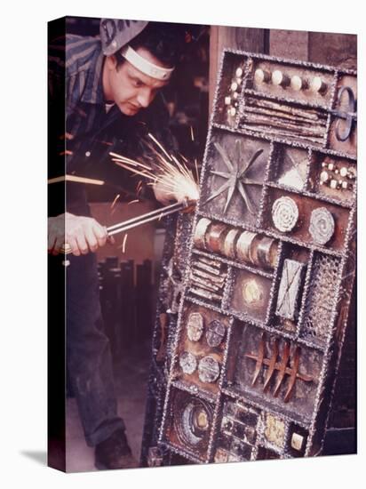 Maker of Metal Furniture, Paul Evans, Hope, PA., Burnishes Door of Steel Chest with Acetylene Torch-Nina Leen-Premier Image Canvas