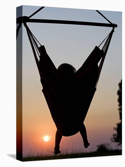 Malawi, Lake Malawi National Park, Young Guest Relaxes in a Hammock at Pumulani Lodge, (MR)-John Warburton-lee-Premier Image Canvas