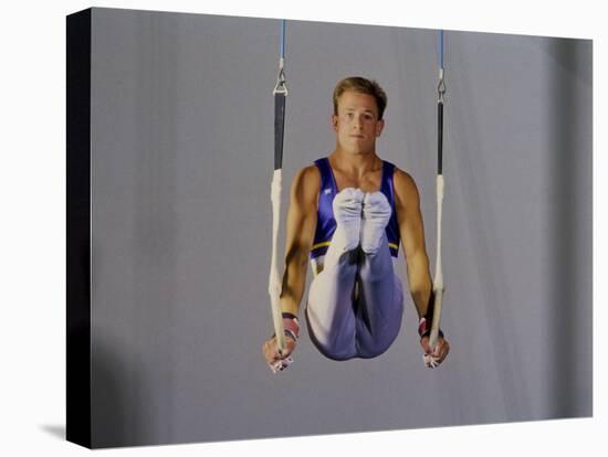 Male Gymnast Performing on the Rings-null-Premier Image Canvas